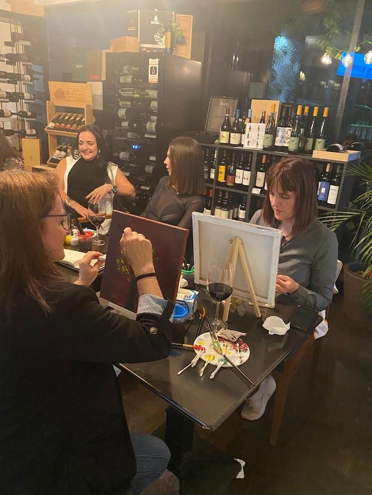 Friends painting together around the table